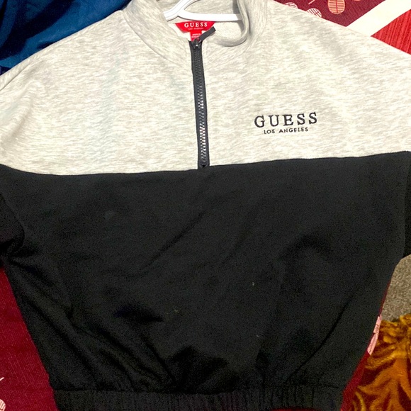 It is a Guess crop top. Black and grey in color. Very comfortable. - Picture 1 of 2
